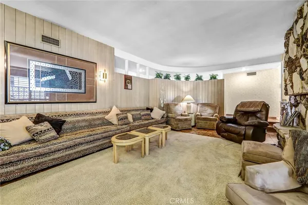 a living room with furniture and a couch