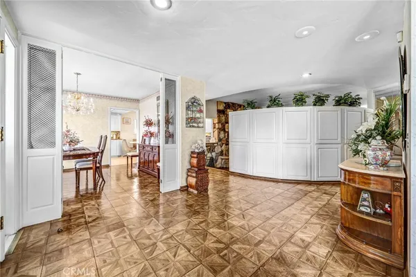 a view of a livingroom with furniture and a kitchen