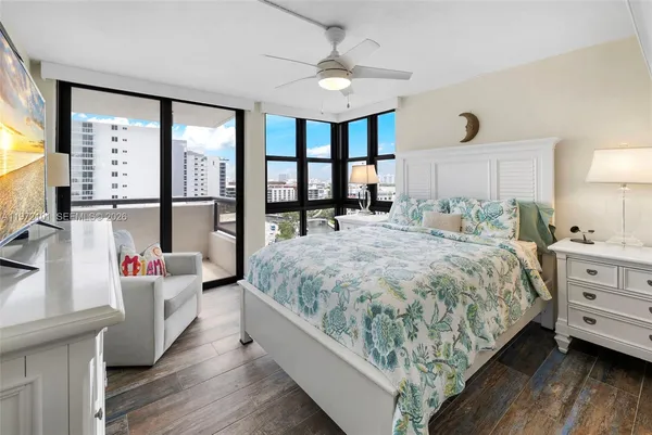 a bed room with a bed and a large window
