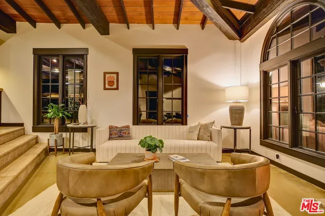 a view of a kitchen with wooden cabinets and a stove