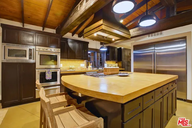 a view of swimming pool with a lounge chair