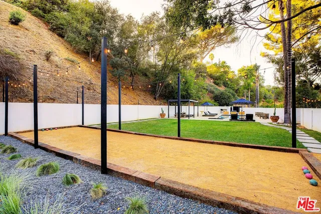 a view of a park with large trees