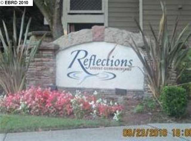 Reflections San Ramon, CA 94583 - Photo 1 of 1 a street sign on a wall next to a road