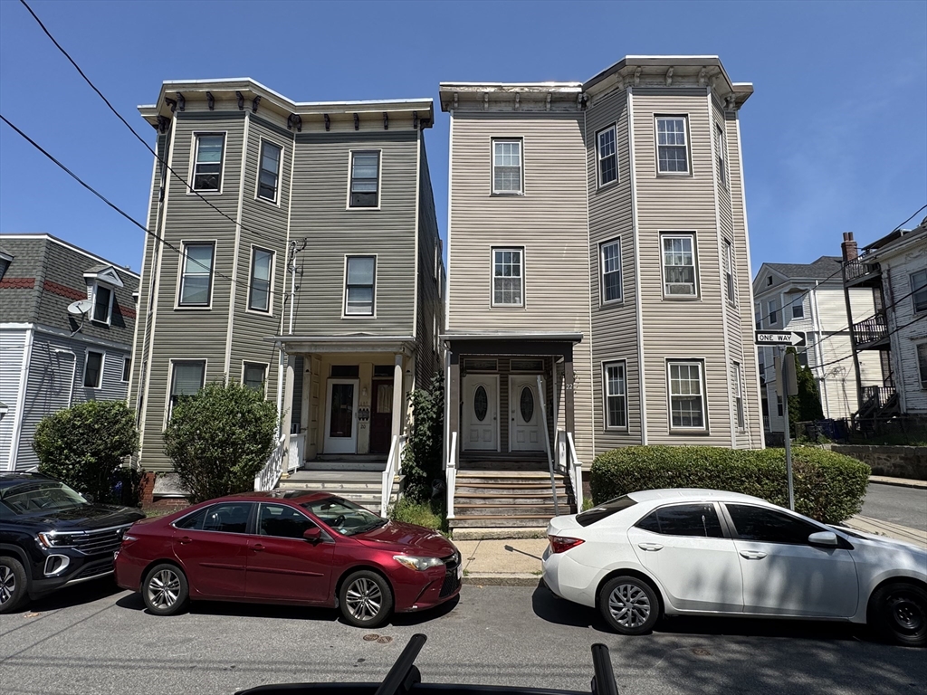 22 Elmore Street, Unit 2 Boston, MA 02119 - Photo 17 of 17 a car parked in front of a house
