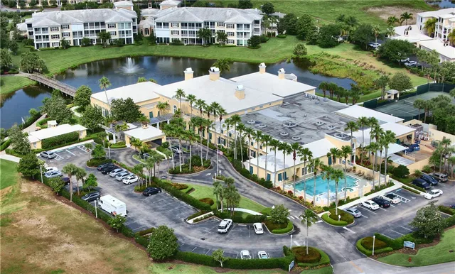 an aerial view of a house with a lake view