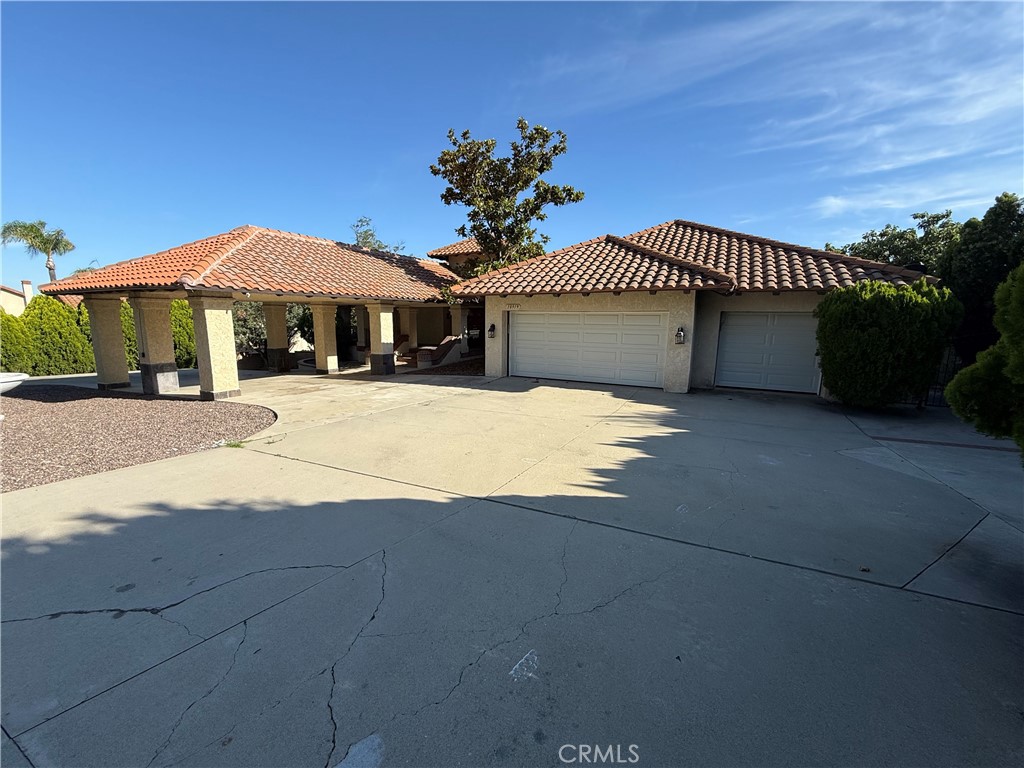 10919 Boulder Canyon Road Rancho Cucamonga, CA 91737 - Photo 1 of 1 a view of a house with a yard
