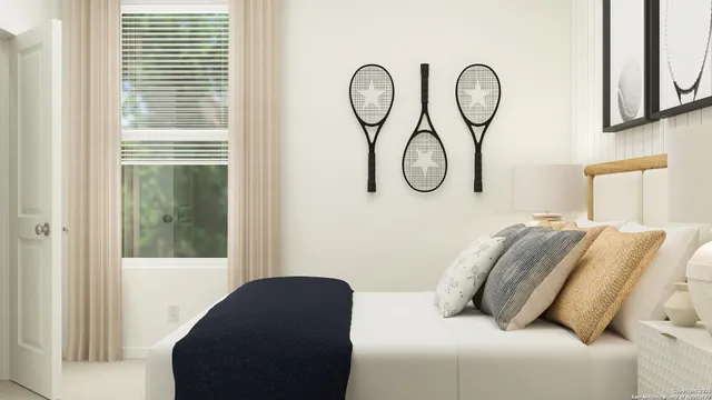 a bedroom with bed and a window