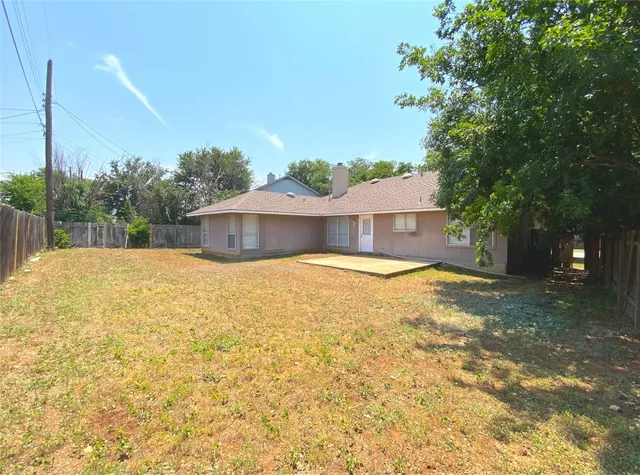 a house view with swimming pool in front of it
