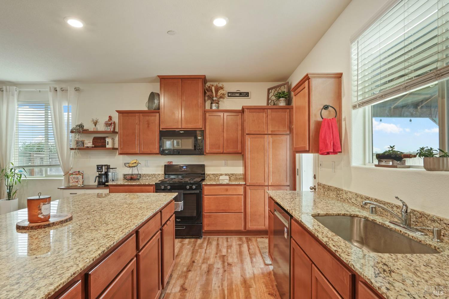 4725 Market Pl Square Rio Vista, CA 94571 - Photo 11 of 37 a kitchen with stainless steel appliances granite countertop a sink stove and refrigerator