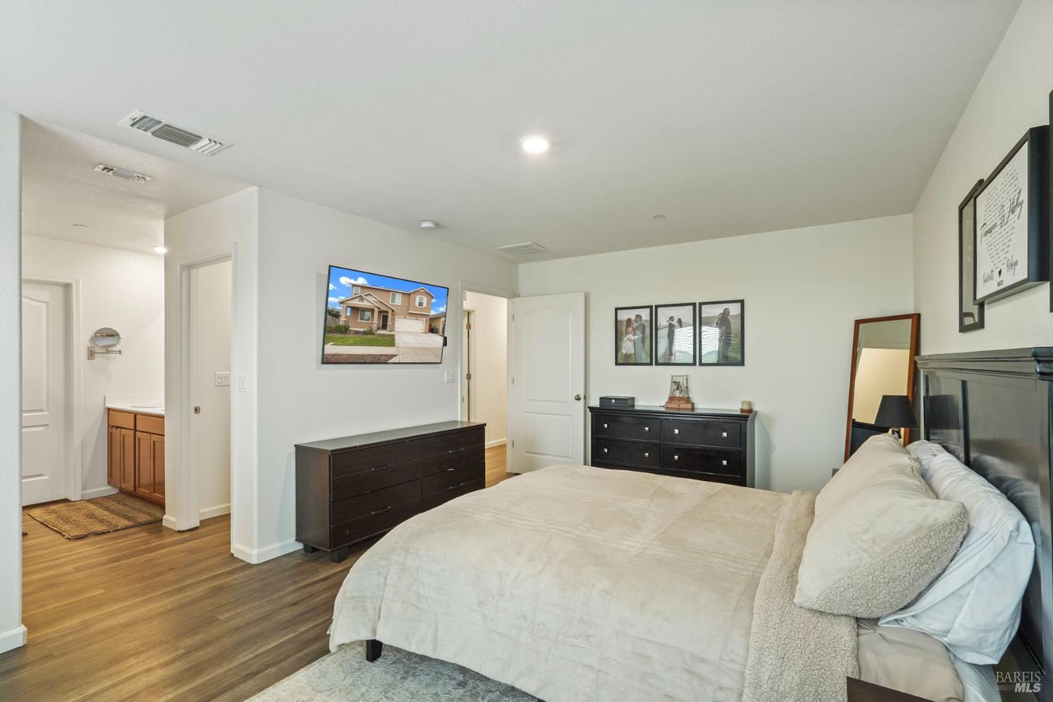 4725 Market Pl Square Rio Vista, CA 94571 - Photo 22 of 37 a bedroom with a bed and wooden floor