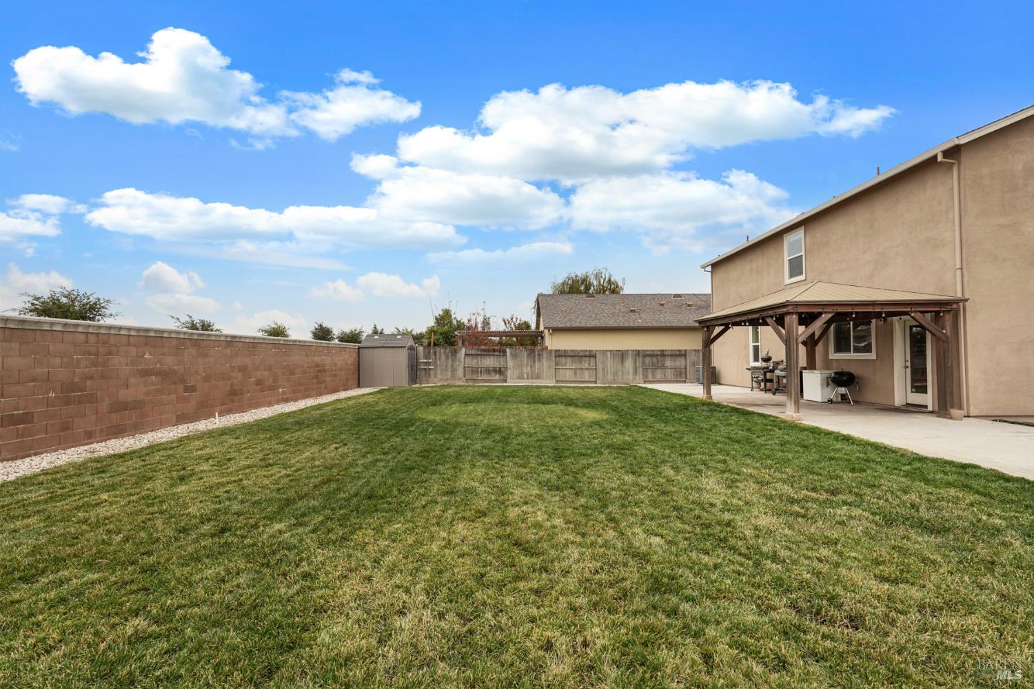 4725 Market Pl Square Rio Vista, CA 94571 - Photo 30 of 37 a view of a house with backyard porch and garden