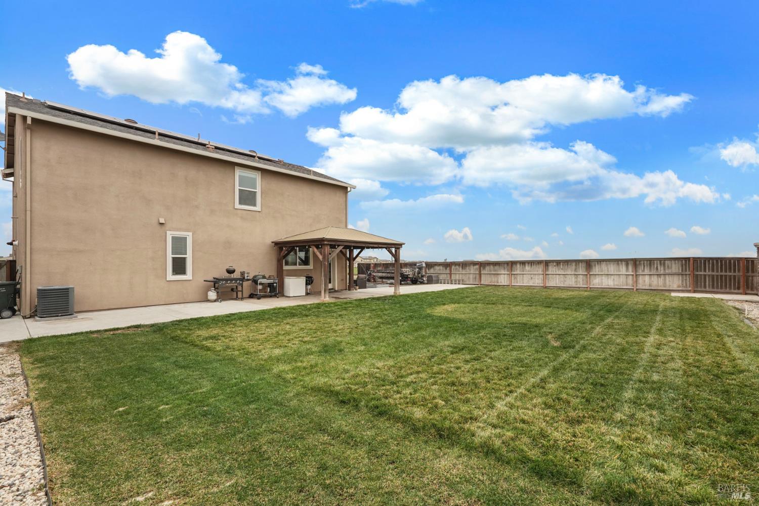 4725 Market Pl Square Rio Vista, CA 94571 - Photo 32 of 37 a view of a backyard with plants and a patio