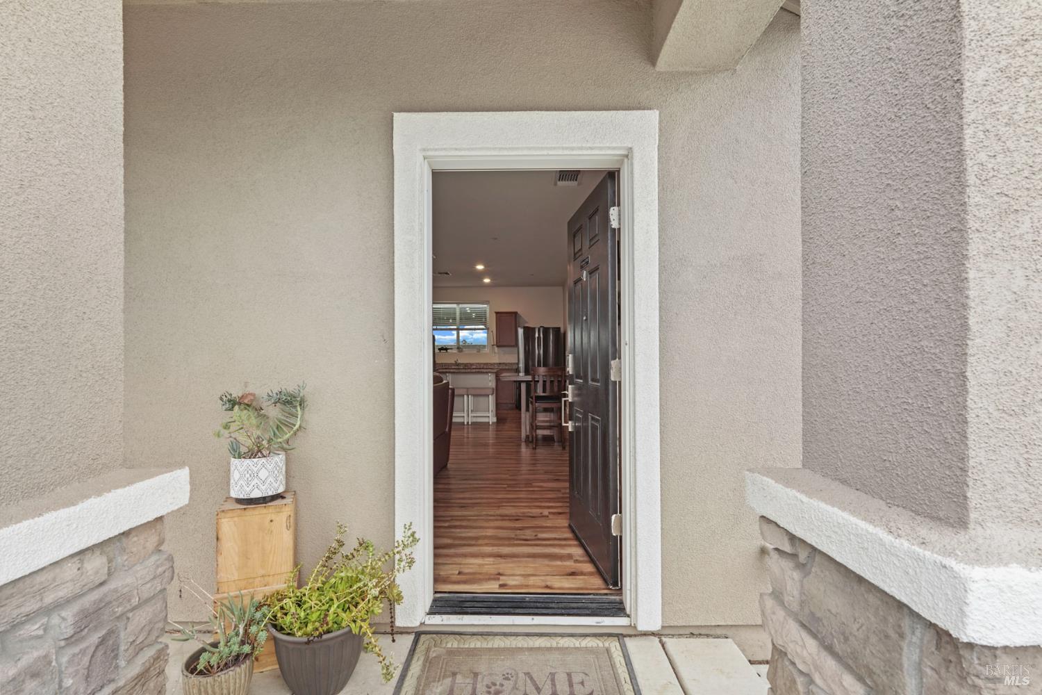 4725 Market Pl Square Rio Vista, CA 94571 - Photo 4 of 37 a hallway with painting and wooden floor