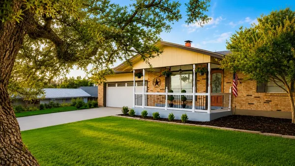 front view of a house with a yard