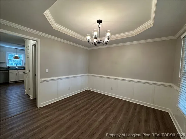 a view of a livingroom with wooden floor