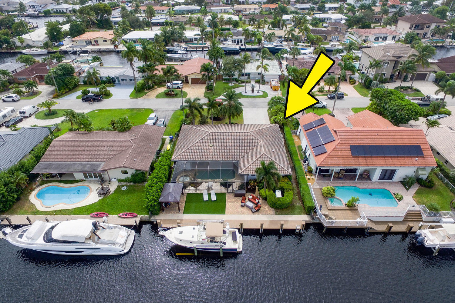 2425 Southeast 9th Street Pompano Beach, FL 33062 - Photo 56 of 91 an aerial view of a house with a swimming pool yard and outdoor seating