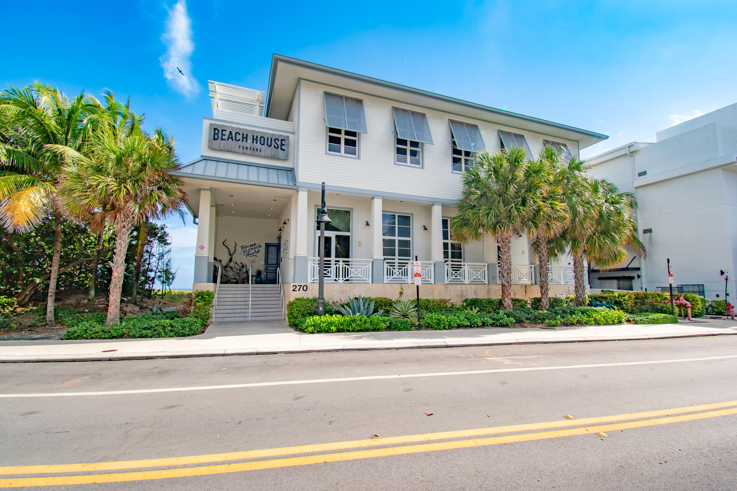 2425 Southeast 9th Street Pompano Beach, FL 33062 - Photo 78 of 91 a front view of a house with a yard and potted plants
