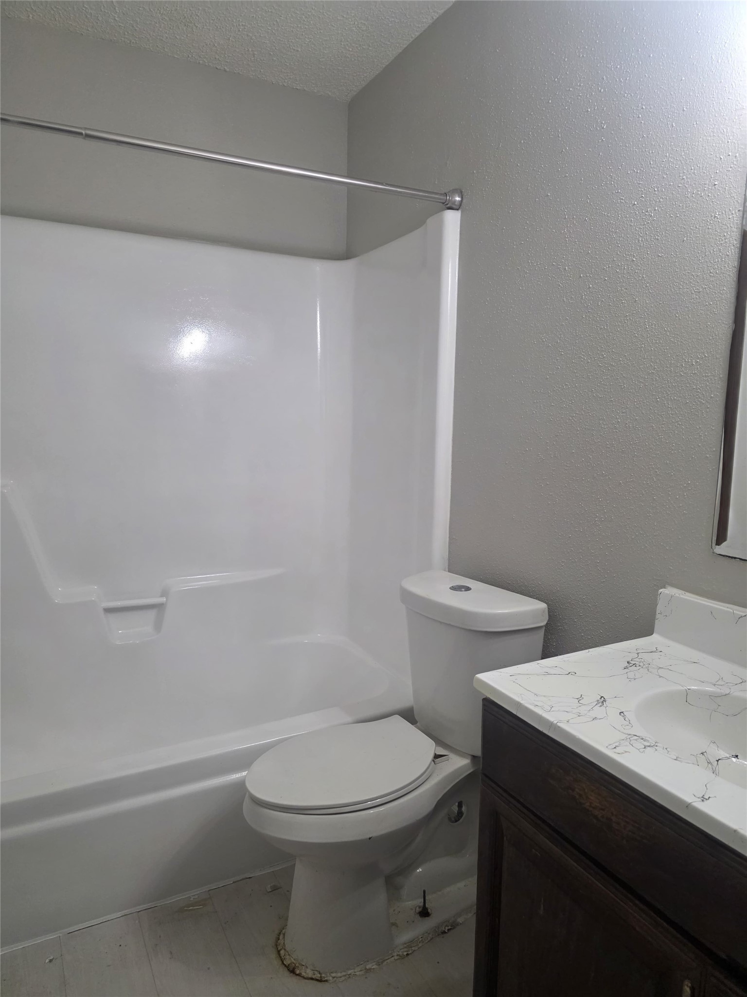 23322 Dew Wood Lane Spring, TX 77373 - Photo 17 of 20 a white toilet sitting next to a bath tub