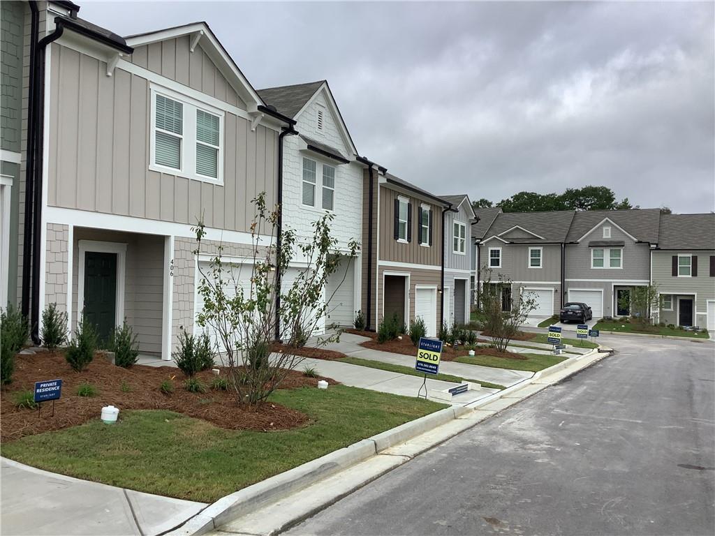 412 Towson Street Villa Rica, GA 30180 - Photo 16 of 21 a front view of house with yard