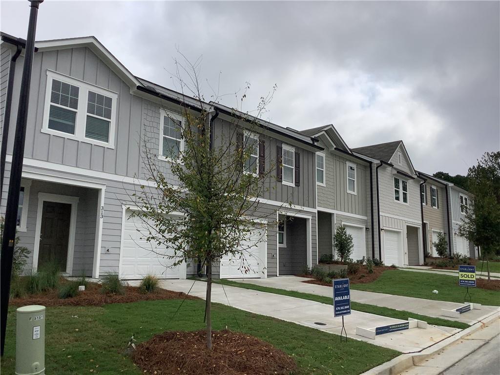 412 Towson Street Villa Rica, GA 30180 - Photo 17 of 21 a front view of a house with garden