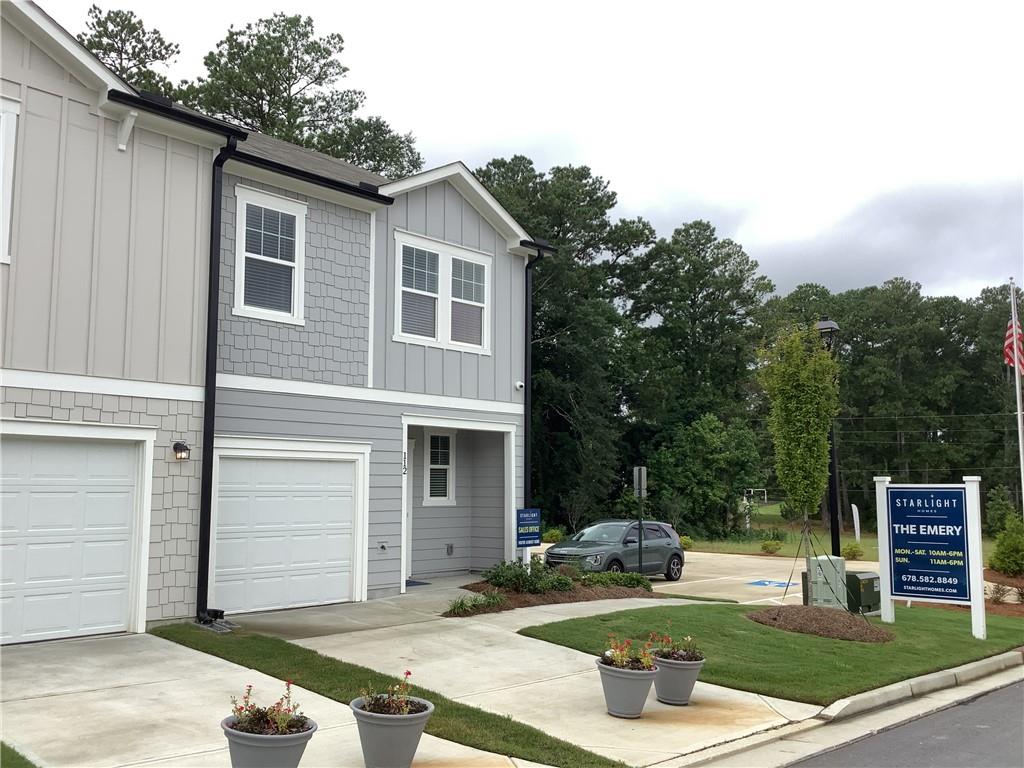 412 Towson Street Villa Rica, GA 30180 - Photo 19 of 21 a view of a house with backyard sitting area and garden
