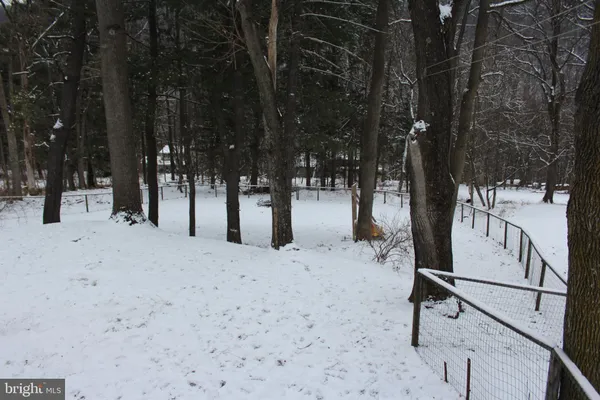 a view of snow on the side of a road