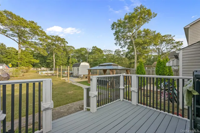a bedroom with a bed dresser and a window