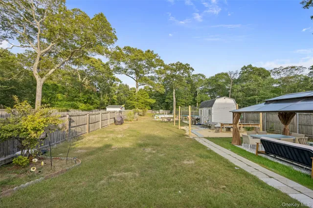 a view of a deck with wooden floor and fence