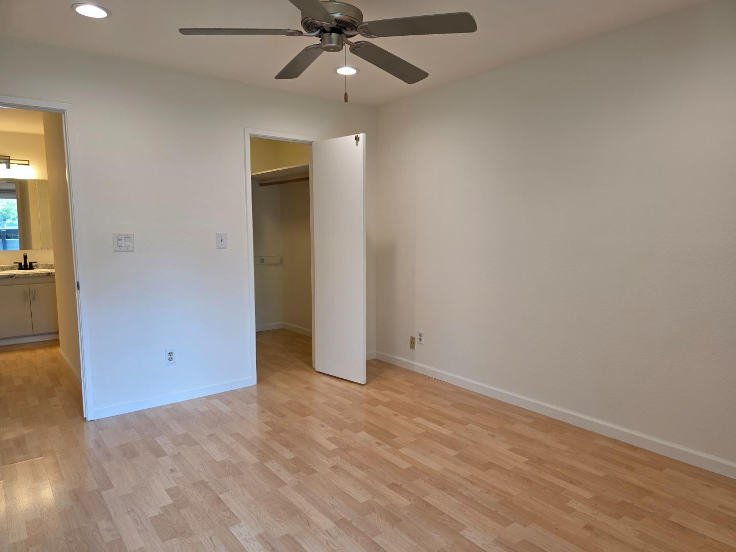 309 Tradewinds Drive, Unit 3 San Jose, CA 95123 - Photo 17 of 34 an empty room with closet and a chandelier fan