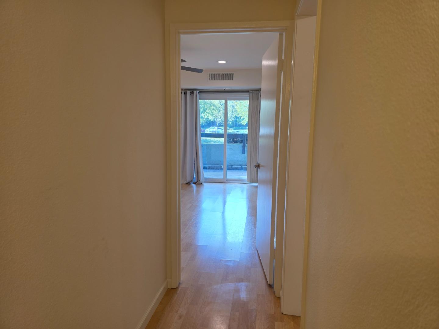 309 Tradewinds Drive, Unit 3 San Jose, CA 95123 - Photo 21 of 34 a view of a hallway with wooden floor