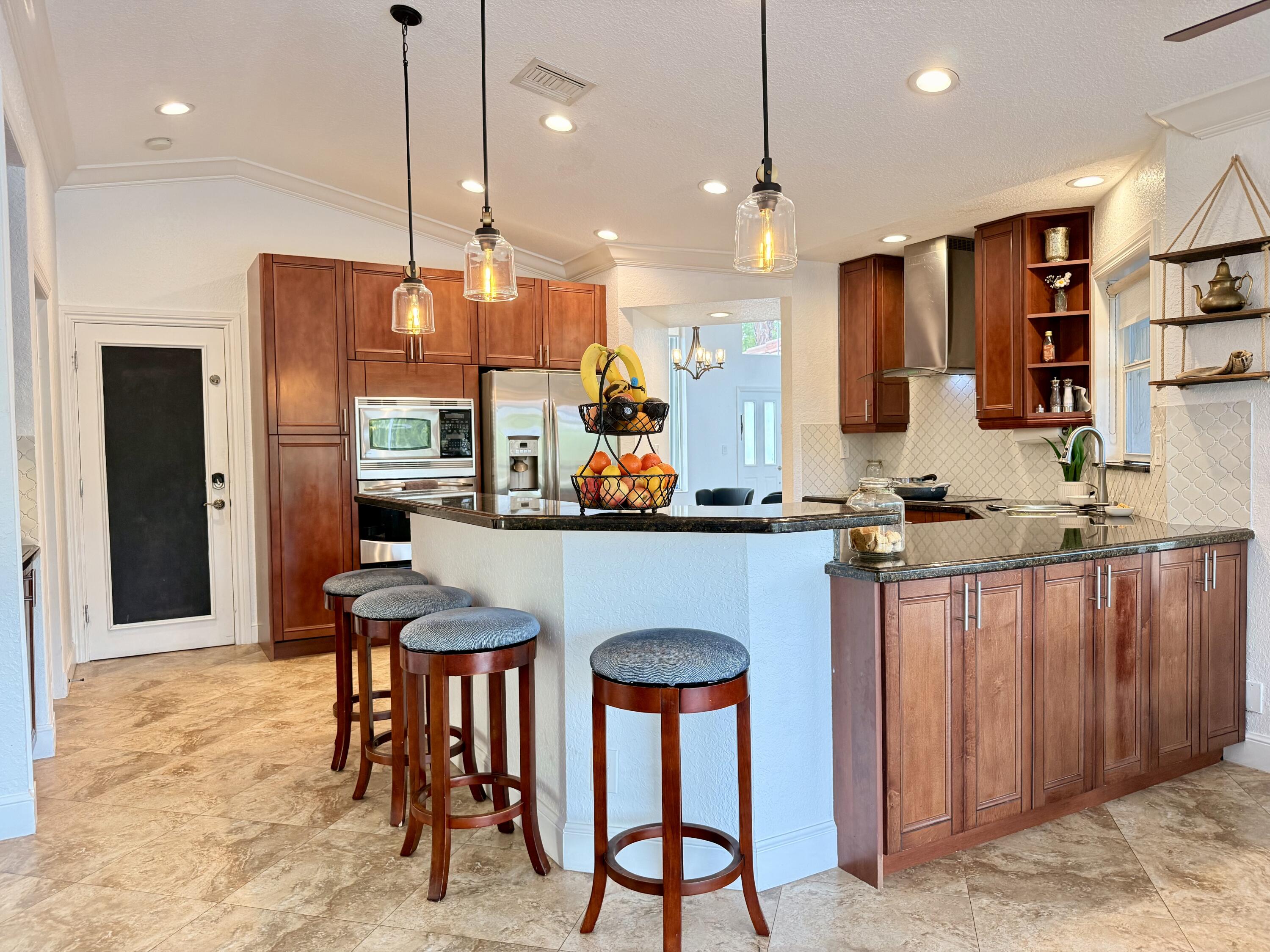 9669 Carousel Circle North Boca Raton, FL 33434 - Photo 15 of 76 Kitchen & Living Area