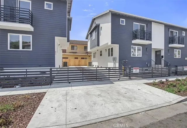 a view of a brick building with many windows