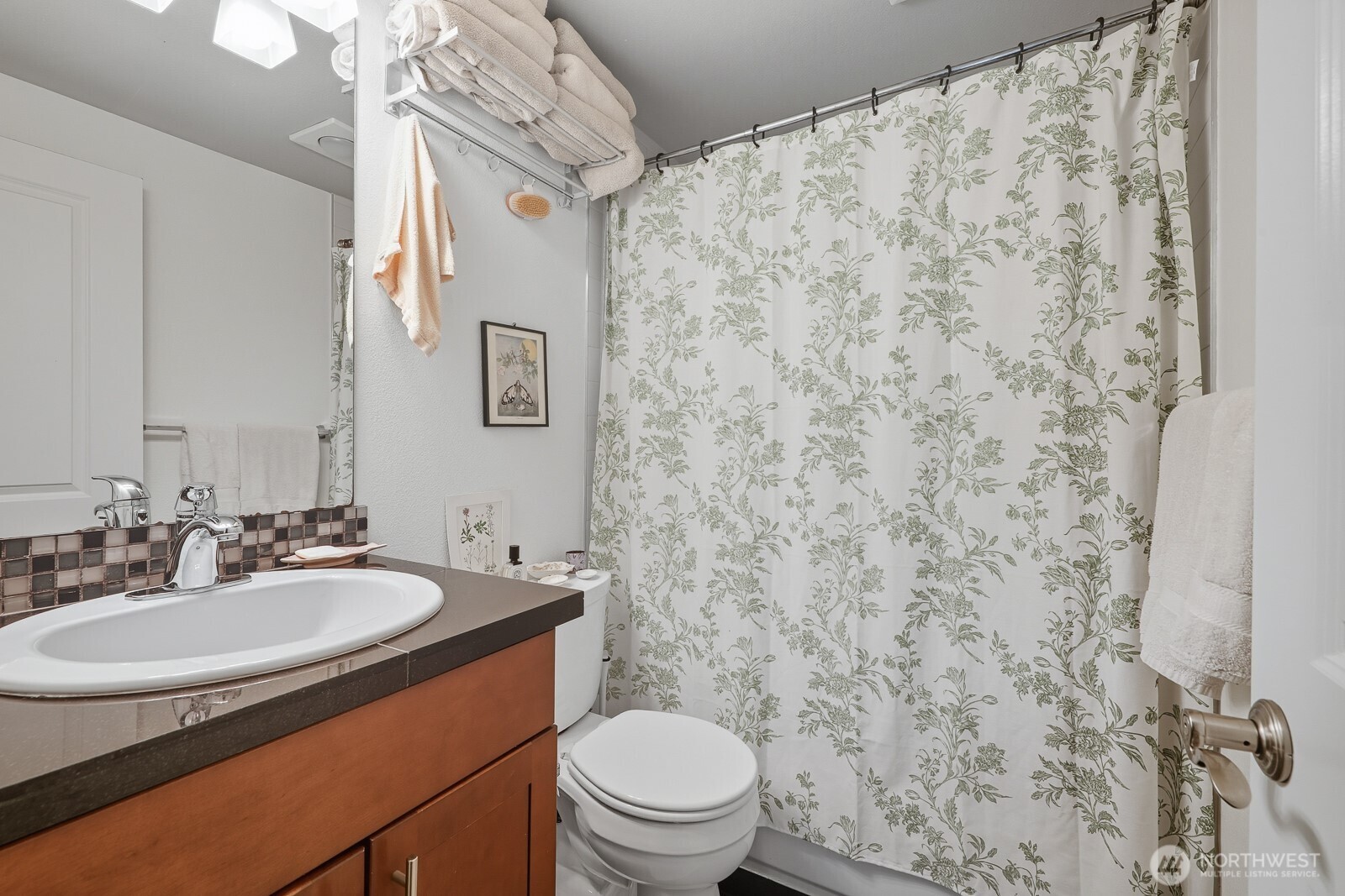 900 Summit Avenue East, Unit 303 Seattle, WA 98102 - Photo 16 of 25 a bathroom with a sink and a toilet