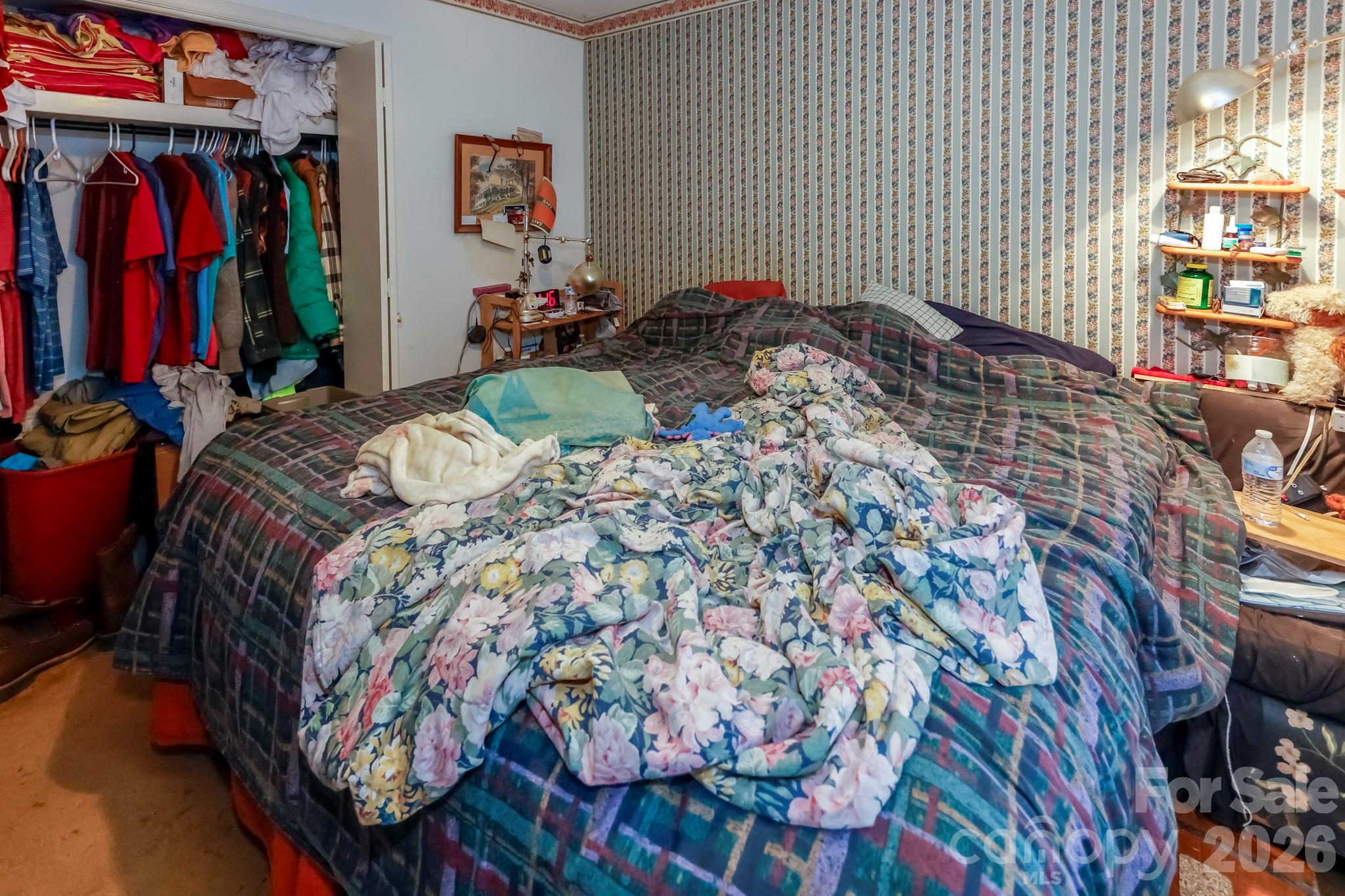 350 Morningstar Lake Road Forest City, NC 28043 - Photo 13 of 27 a bed sitting in a bedroom next to a window