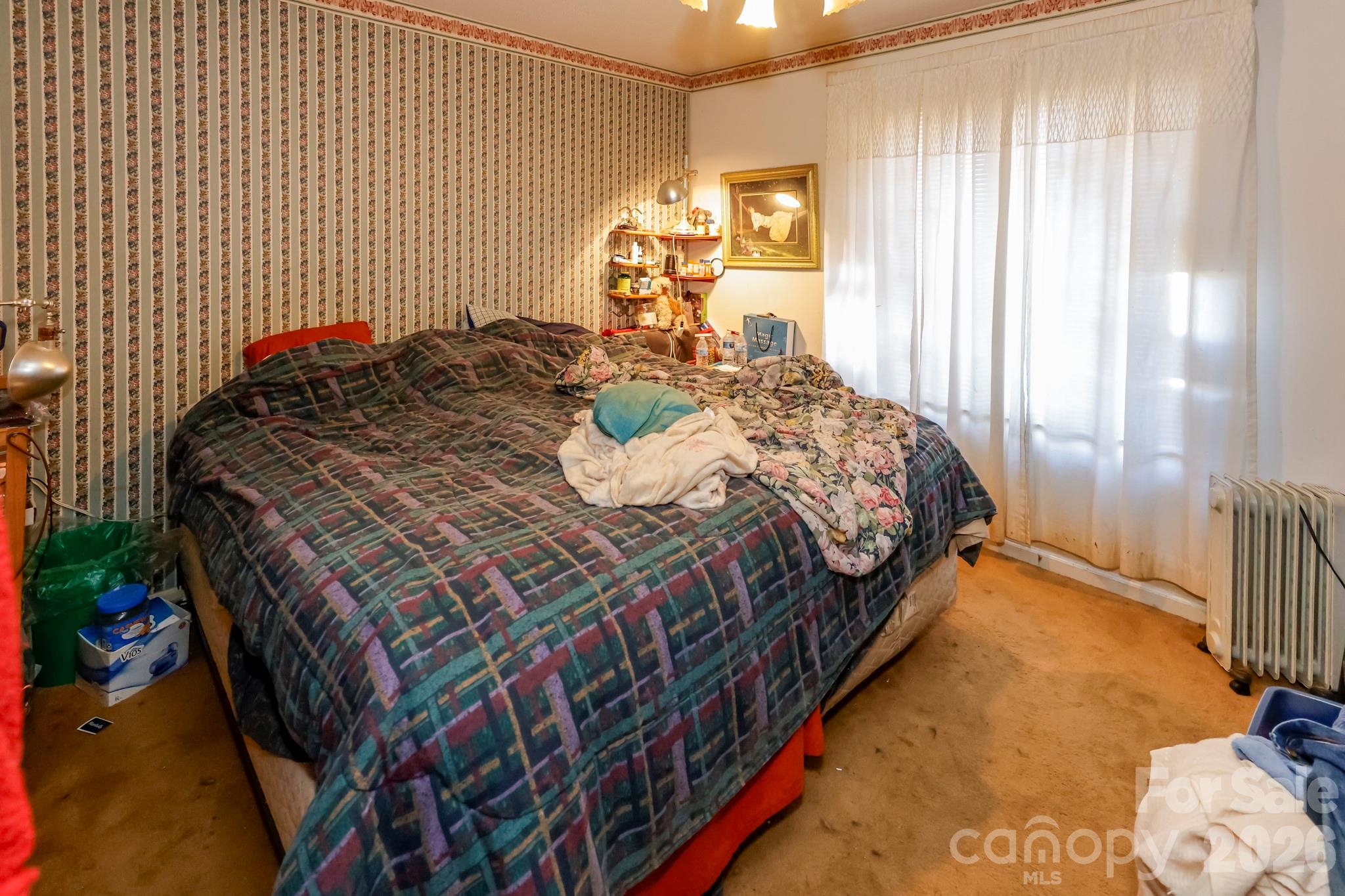 350 Morningstar Lake Road Forest City, NC 28043 - Photo 14 of 29 a bedroom with a bed and a window