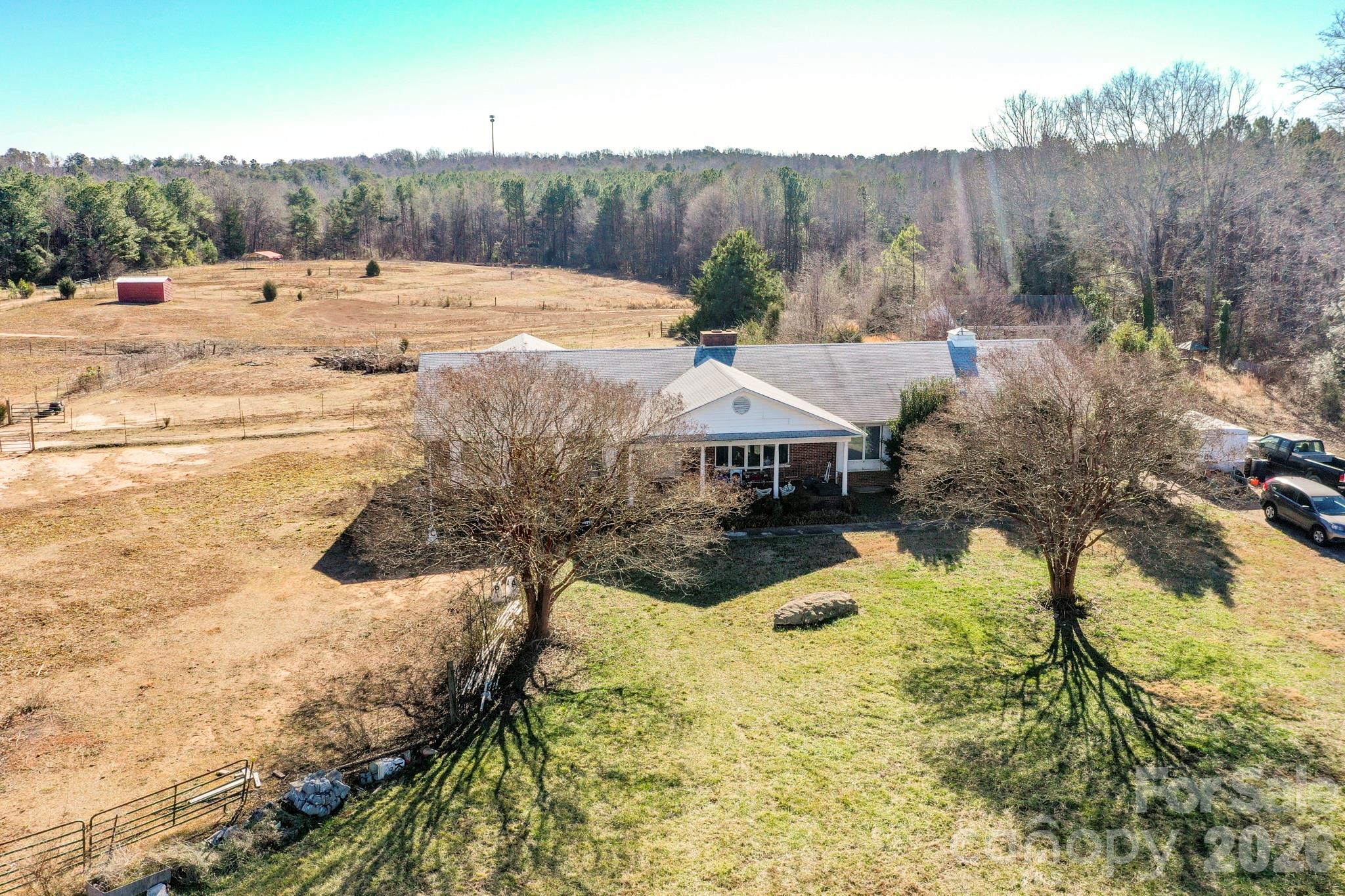 350 Morningstar Lake Road Forest City, NC 28043 - Photo 4 of 27 a view of a house with a yard covered with snow in the background