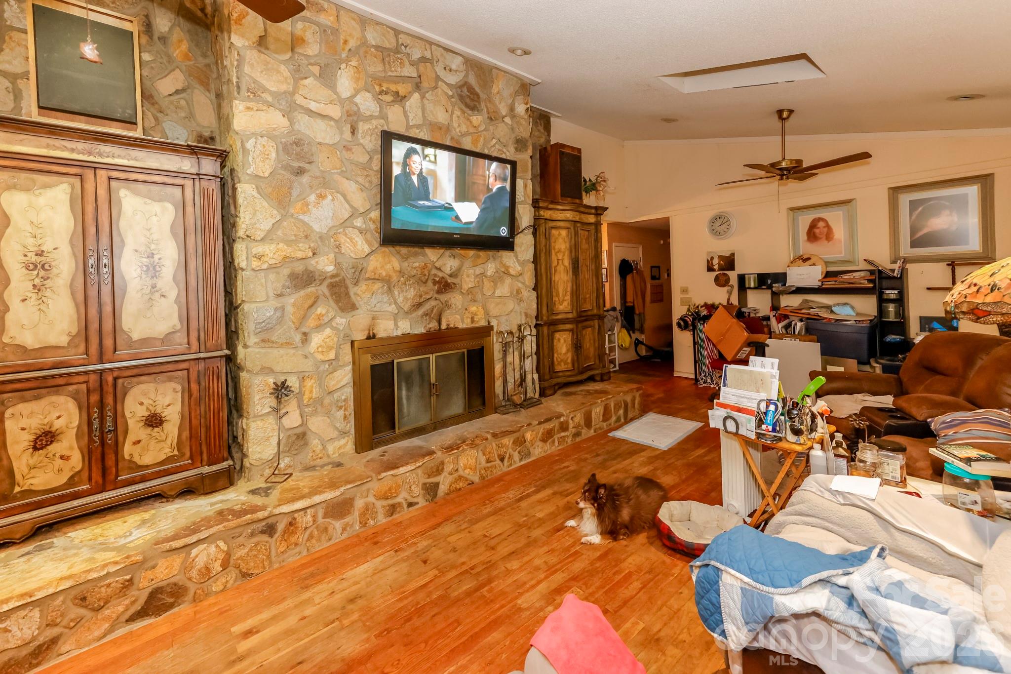 350 Morningstar Lake Road Forest City, NC 28043 - Photo 9 of 29 a living room with patio furniture and a flat screen tv