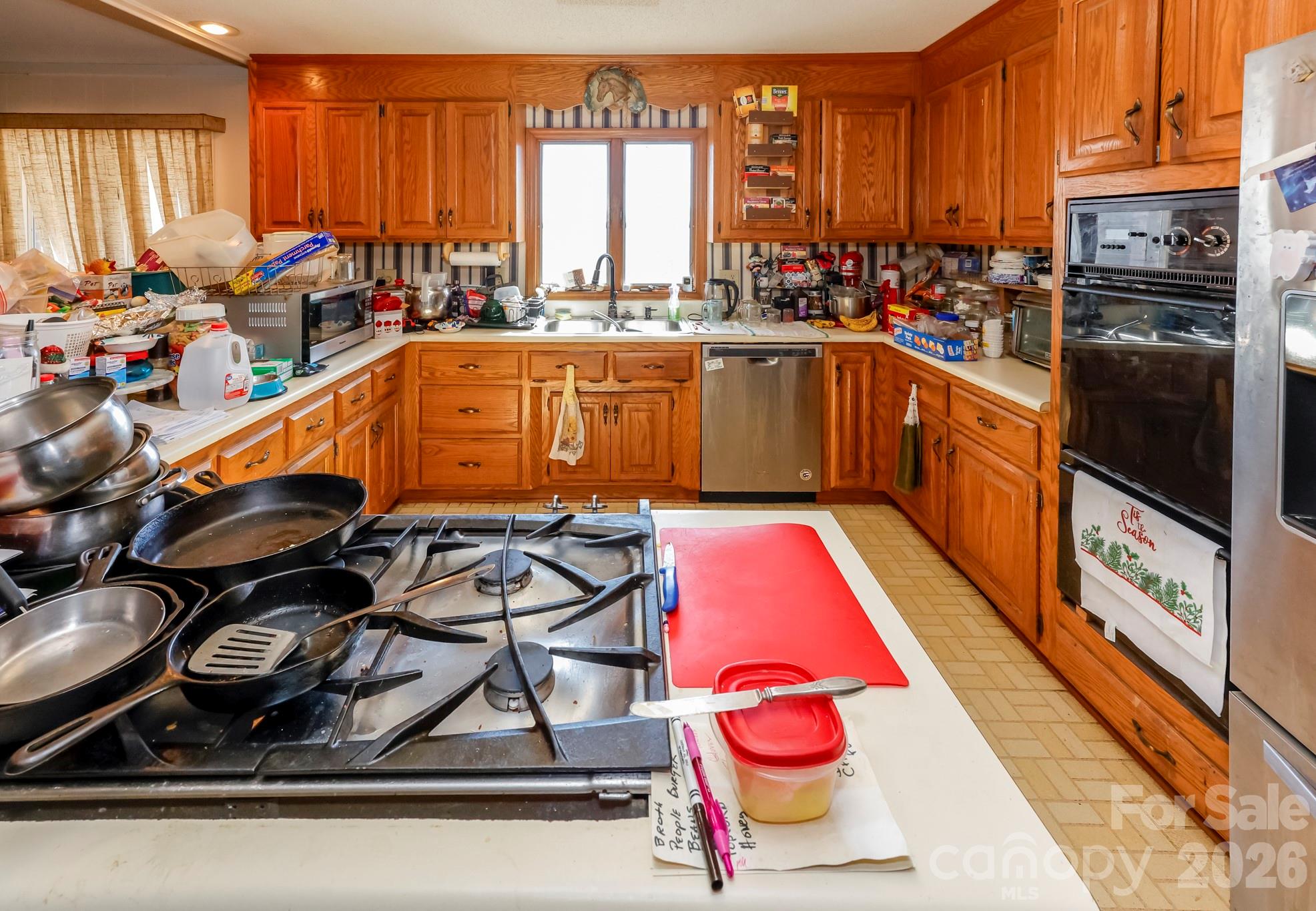 350 Morningstar Lake Road Forest City, NC 28043 - Photo 9 of 27 a kitchen with stainless steel appliances granite countertop a stove a sink and a microwave