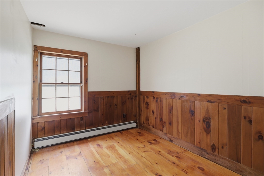 5 Gap Mountain Road Fitzwilliam, NH 03447 - Photo 12 of 31 a view of an empty room with wooden floor and a window
