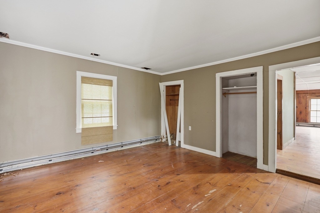 5 Gap Mountain Road Fitzwilliam, NH 03447 - Photo 8 of 31 an empty room with window and wooden floor