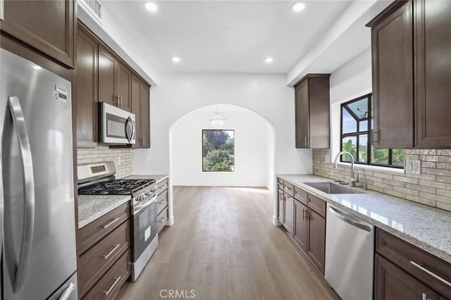 an empty room with a empty space and a ceiling fan