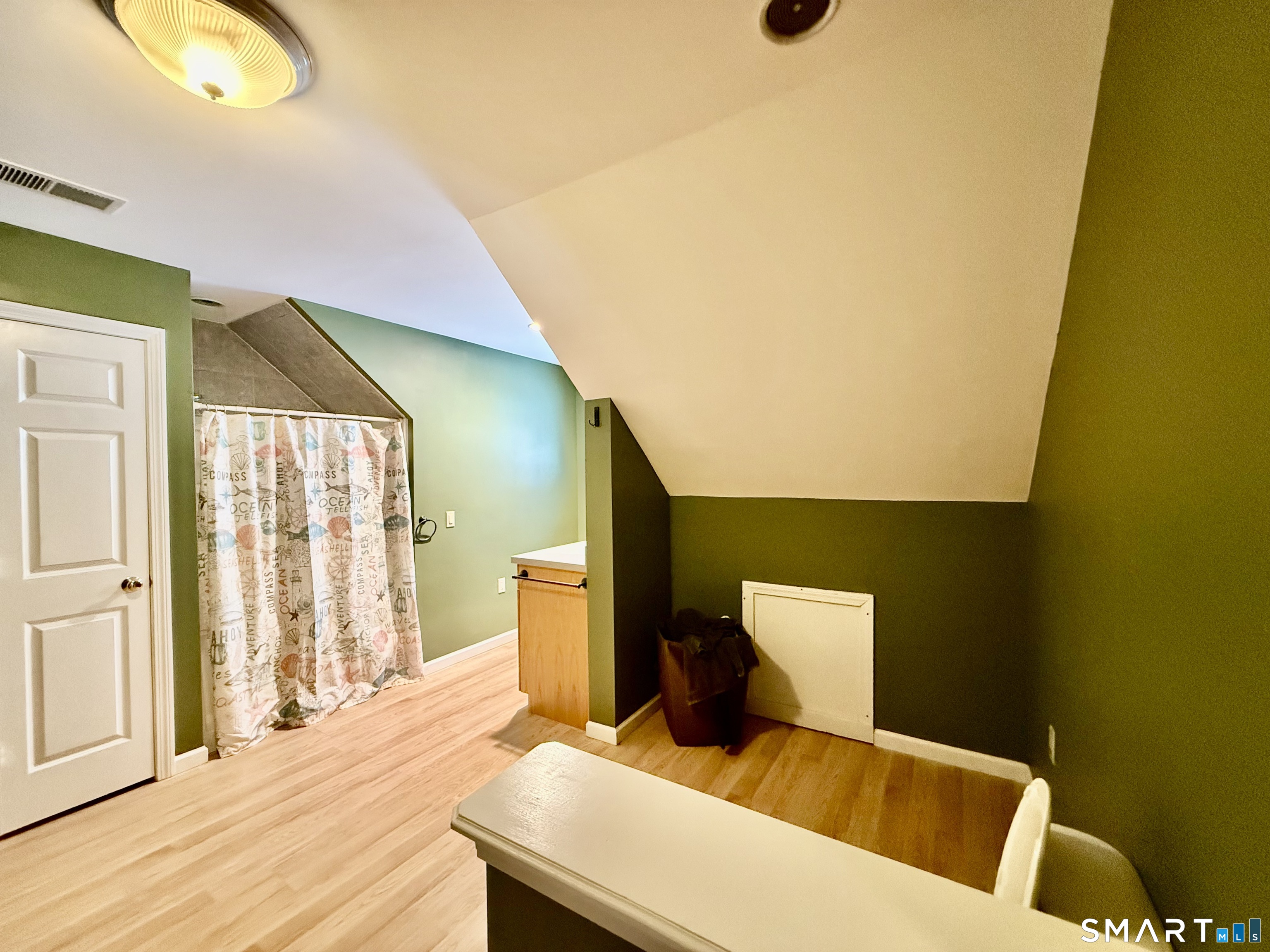 1425 Exeter Road Lebanon, CT 06249 - Photo 13 of 28 a bedroom with a bed and wooden floor