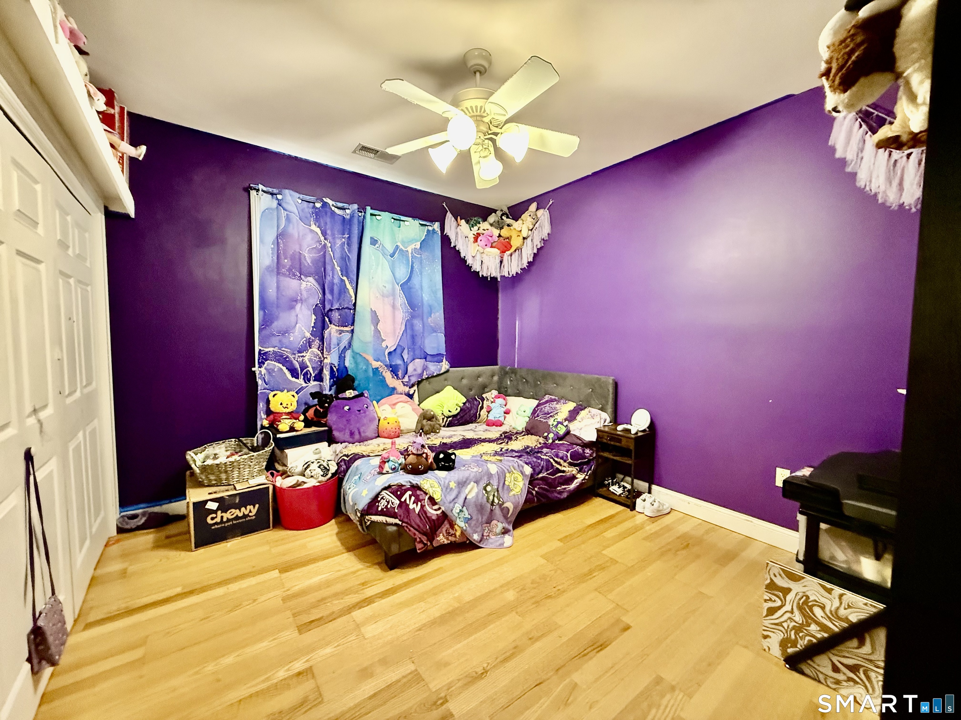 1425 Exeter Road Lebanon, CT 06249 - Photo 17 of 28 a bedroom with a bed dresser and a chandelier