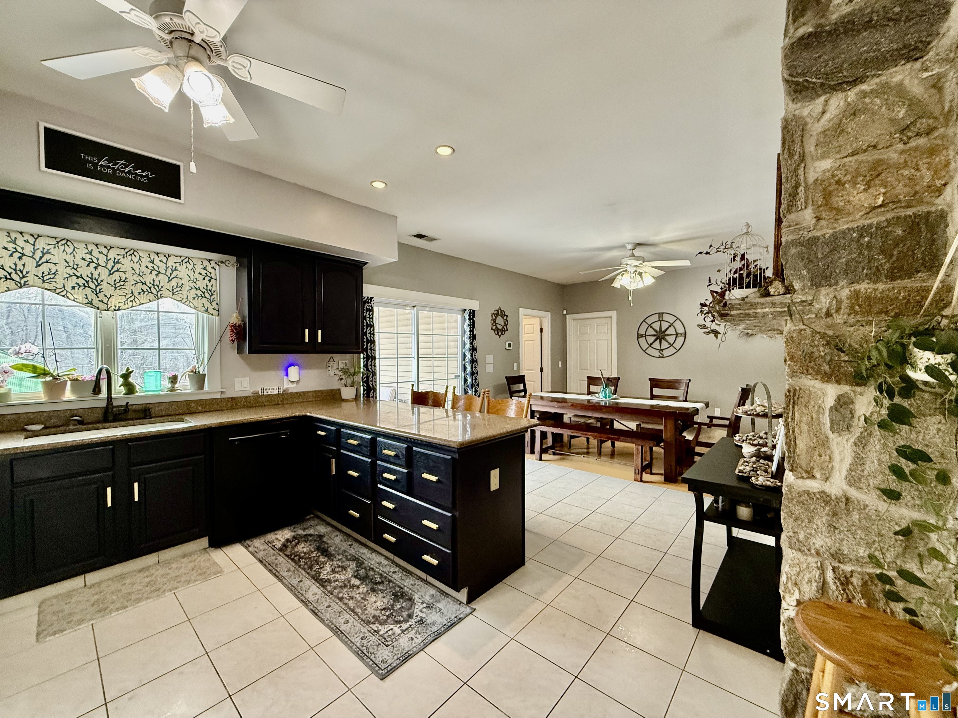 1425 Exeter Road Lebanon, CT 06249 - Photo 5 of 28 a kitchen with stainless steel appliances kitchen island granite countertop a refrigerator and a stove top oven