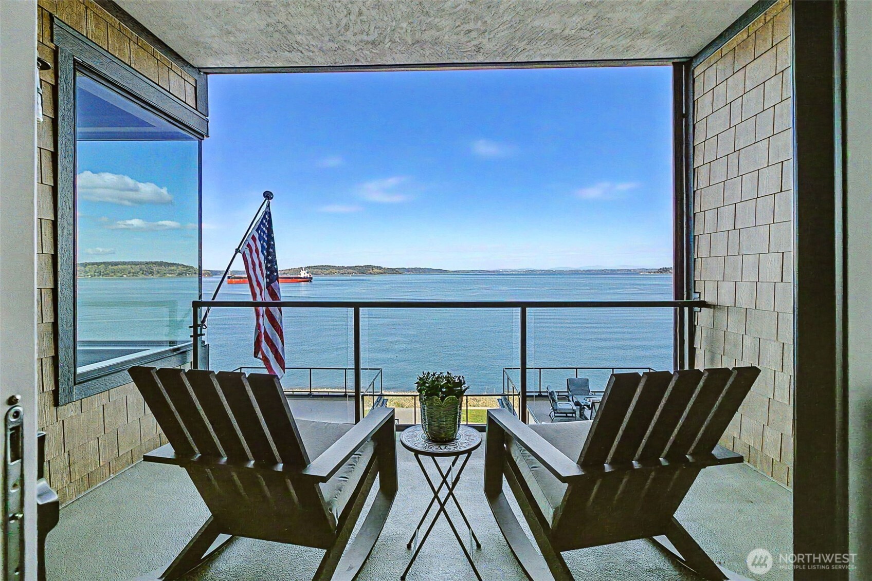 4907 Main Street, Unit 608 Tacoma, WA 98407 - Photo 1 of 40 a view of a balcony with chairs