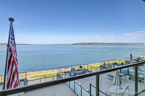 a view of a balcony with chair and table