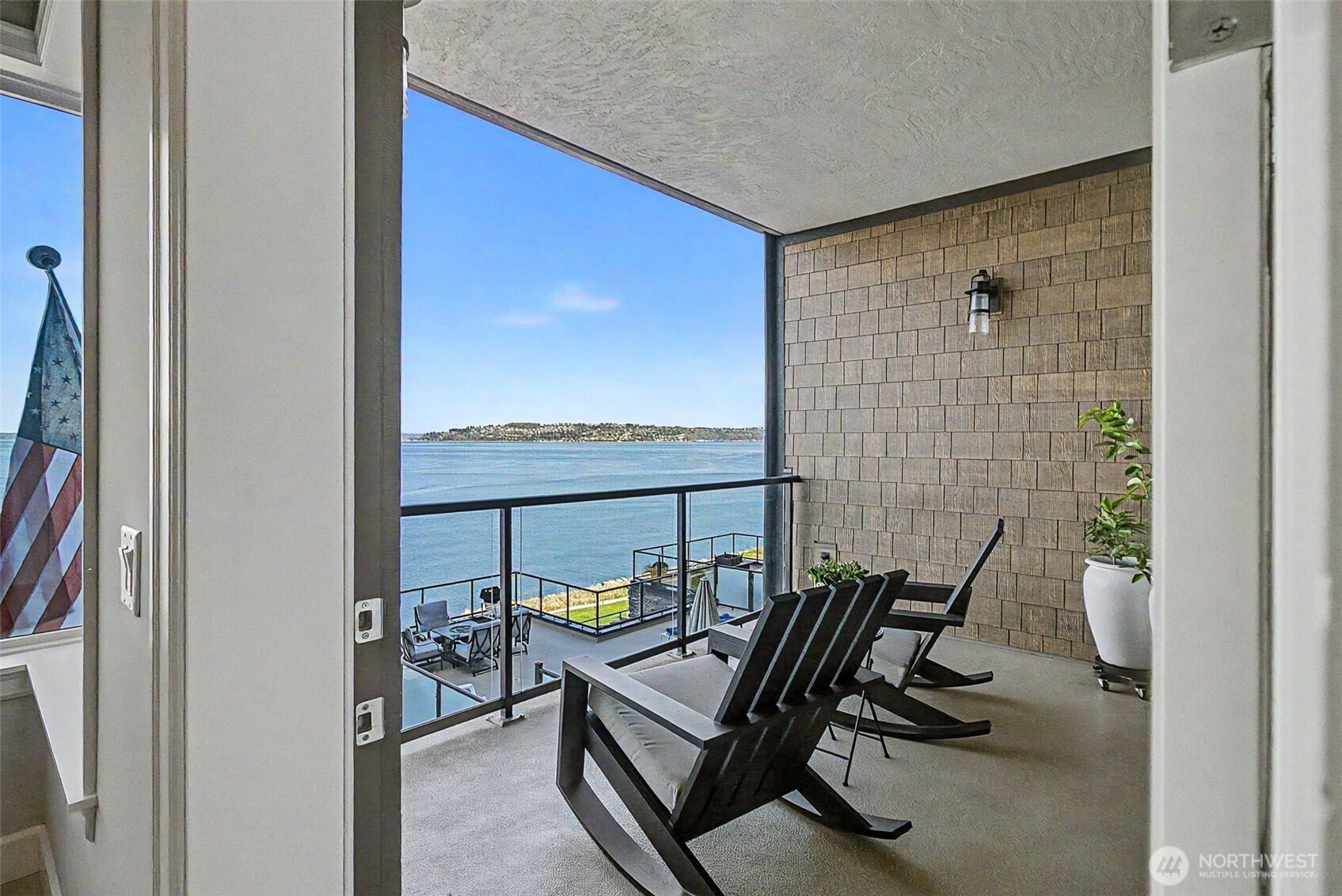 4907 Main Street, Unit 608 Tacoma, WA 98407 - Photo 14 of 40 a view of a balcony with chair and table
