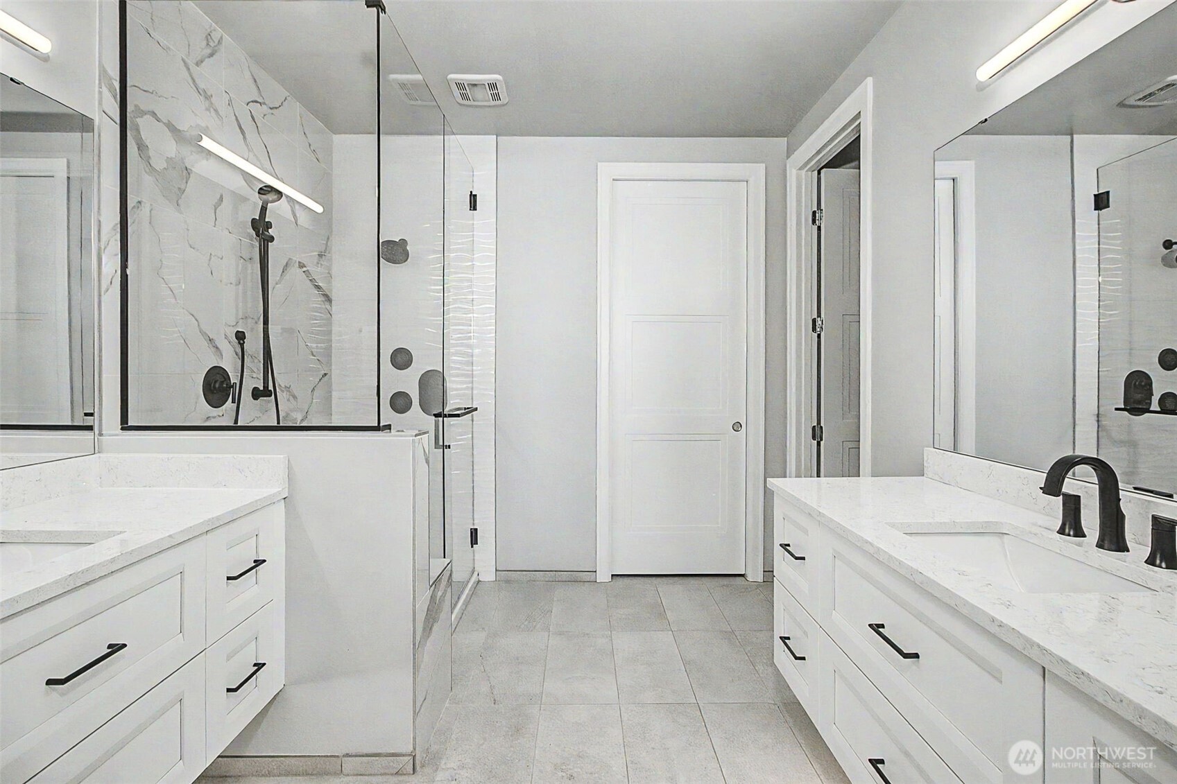 4907 Main Street, Unit 608 Tacoma, WA 98407 - Photo 17 of 40 a bathroom with a granite countertop sink a mirror a vanity and a shower