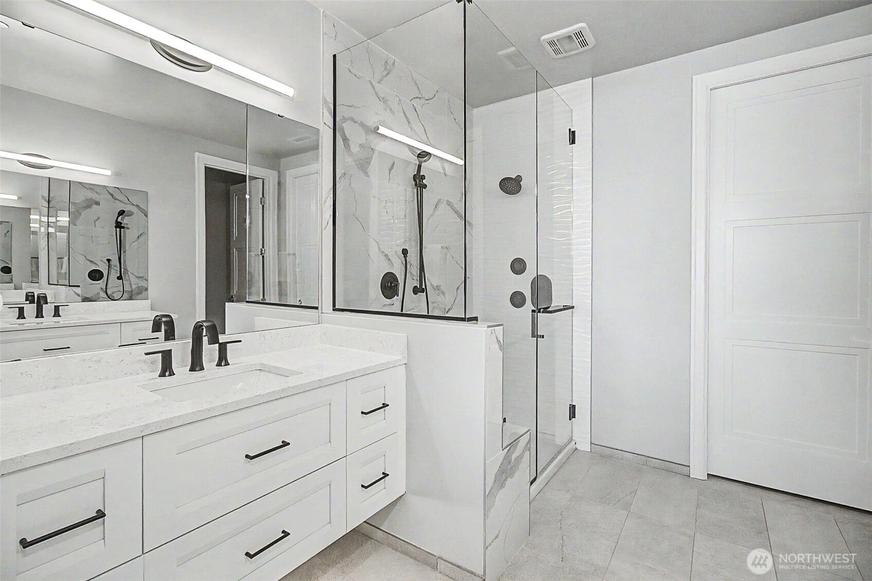 4907 Main Street, Unit 608 Tacoma, WA 98407 - Photo 18 of 40 a bathroom with a double vanity sink mirror and shower