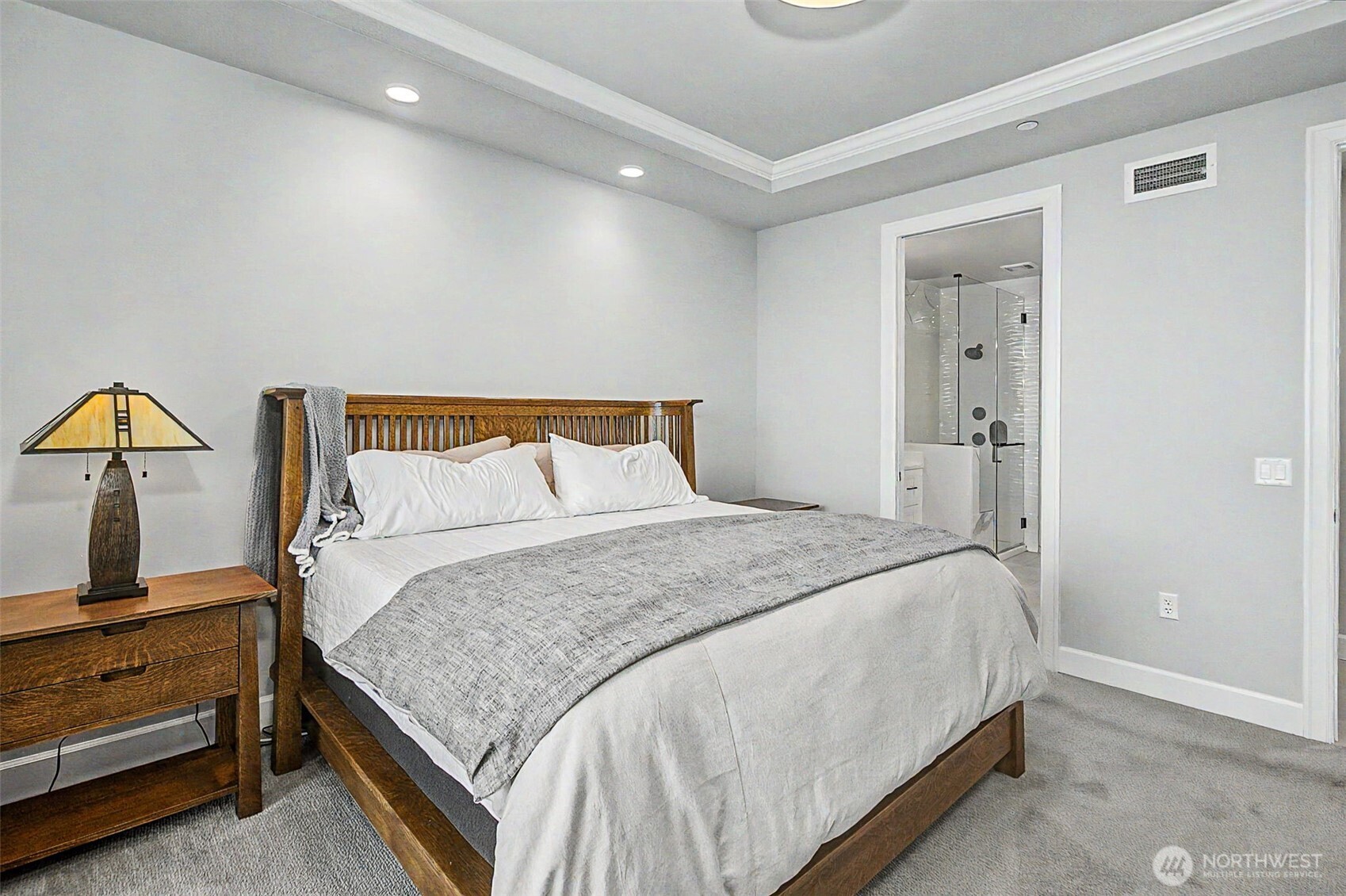 4907 Main Street, Unit 608 Tacoma, WA 98407 - Photo 22 of 40 a bedroom with a bed and lamp